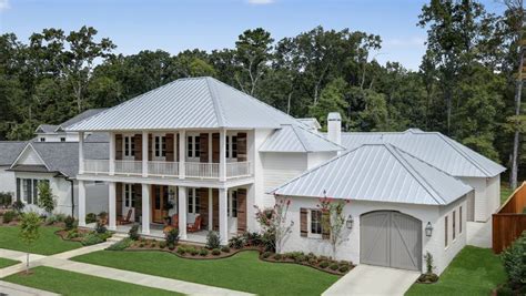 white house with withe metal roof|white standing seam metal roof.